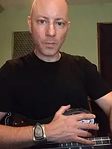 American musician Peter Freeman wearing a fordite bracelet, 2015.