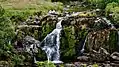 a view of a picnic above the upper cascade of the Loup of Fintry waterfalls