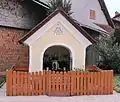 Pietà shrine in the village center of Šujica