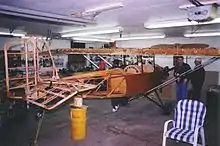 A Pietenpol Air Camper under construction, showing the wooden frame structure that will be covered with aircraft fabric.