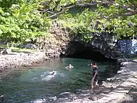 Piula Cave Pool by the sea below the chapel.