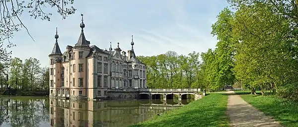 Image 12Poeke CastlePhoto: Marc RyckaertPoeke Castle is a castle near Poeke, Belgium. Standing on 56 hectares of park, the castle is surrounded by water and is accessible through bridges at the front and rear of the building.More selected pictures