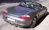 Porsche Boxster circa 2004, with detachable clear plastic windblocker and a Z-fold top