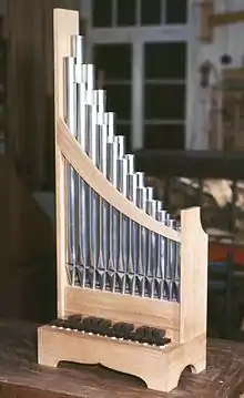 cf. Portative organ (portable pipe organ with bellows)