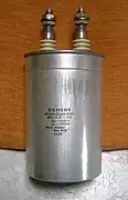 Power film capacitor for PFC, packaged in a cylindrical metal can