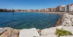 Silgar Beach with the Madama sculpture in the sea