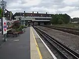 Northbound platform looking east with an A Stock on the southbound platform. The Wembley Stadium arch is visible on the right in the background.