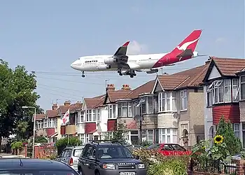 Image 32Qantas Boeing 747-400 about to land at Heathrow Airport, seen beyond the roofs of Myrtle Avenue, Hounslow.