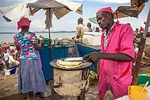 A "Rolex" merchant frying chapatis