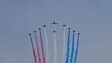 The Red Arrows fly over the Mall.