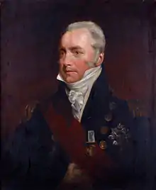 Painting shows a gray haired man in a dark blue military coat with a white frilled shirt and a red sash.