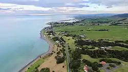 Whakatīwai, looking south towards Kaiaua and Pūkorokoro / Miranda