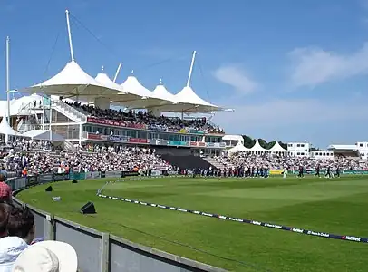 Main pavilion at the Rose Bowl. The England team are taking to the field in a friendly match against Hampshire.