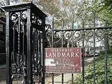 Photo of the Historic Landmark sign on the entrance to Roslyn Place