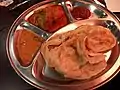 Roti canai with curry chicken in New Zealand