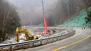 Repair of Route 2 after a 6-mile washout along the Cold River caused by Hurricane Irene.