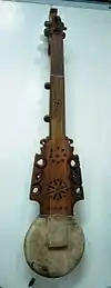 Pamiri rubab, longer necked type of rubab, sound holes up neck show it is hollow