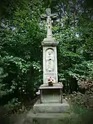 19th century stone shrine of Christ Crucified