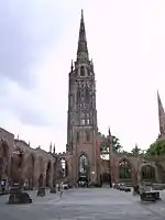 The surviving tower and steeple, which functions as a working bell tower.