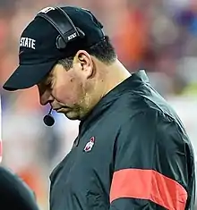 Ryan Day looks down at his play sheet