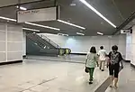 Escalators at concourse paid area to the linkway.