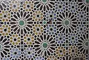 Twelve-pointed star motifs in zellij tilework at the Saadian Tombs in Marrakesh, Morocco (16th century)