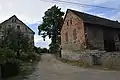 A house and a barn by the road