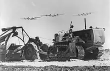 Seabees completing runway on Saipan in 1945 with B 29 in the air