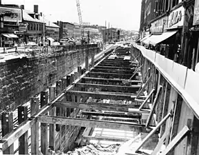 A cut-and-cover tunnel being constructed in an urban street