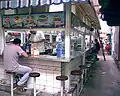 Eating at a soda in the market