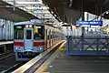 A Sanyo Electric Railway trainset passing by the station