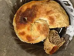 Sarburma is a Crimean traditional meat pie dish originating among ethnic Crimeans. It is a widespread snack in Crimea. Its main ingredients are lamb and dough.