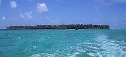 Photograph of the small, coral atoll of the island of Satawal in the Pacific Ocean.