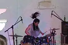 Sayaka Himeno on drums for Nisennenmondai in 2009