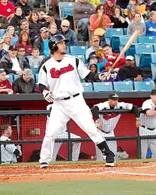 A baseball player in white