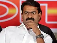 A serious-looking, mustachioed Seeman