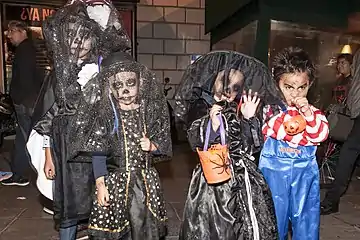 Three children dressed as Catrinas