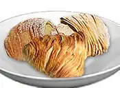 Sfogliatelle are shell-shaped filled pastries native to Italian cuisine.