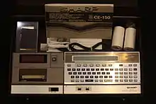 The Sharp PC-1500 with printer/plotter and cassette interface in travel case.