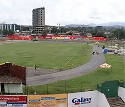 Grass field encircled by a track