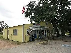 The US Post Office shares a building with a business.