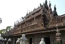 Monastery exterior, with intricately-carved wood