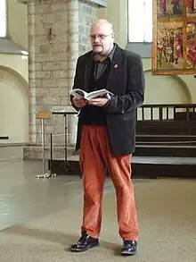 Karl Martin Sinijärv performing in Niguliste church during Tallinn Literature Festival