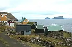 Skarvanes, with the islands of Lítla Dímunand Stóra Dímun in the background