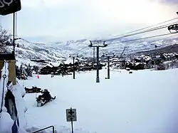 The base of Snowmass Mountain, including a view of Snowmass Village