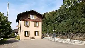 Three-story building with gabled roof