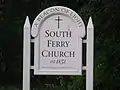 Sign identifying the church and its status as a historic place.