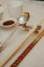 A spoon and chopstick rest in a Chinese buffet in Kuala Lumpur, Malaysia