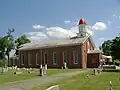 St. Alphonsus Catholic Church; the monument is in front of the church in this picture