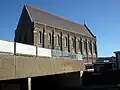 The rear of the church towering above the London Road multi-storey car park in the foreground.